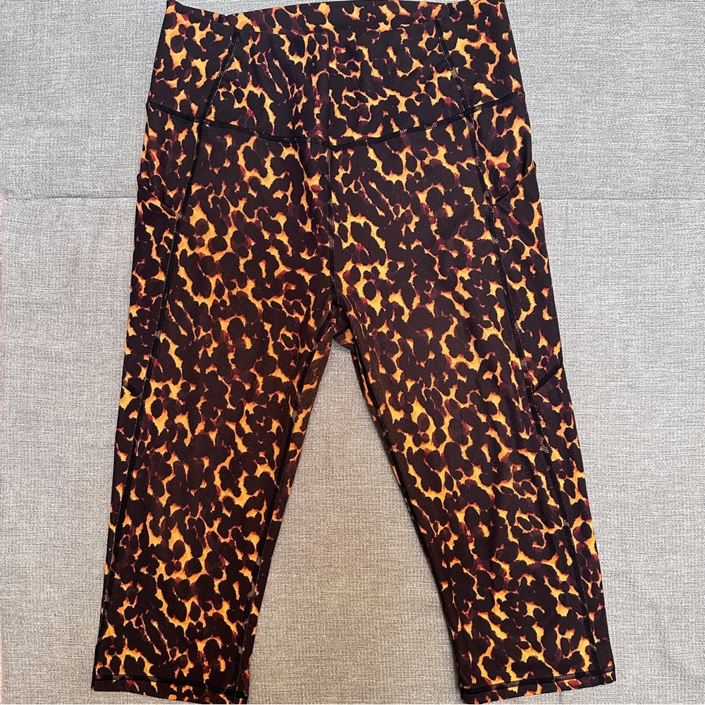 Fabletics PureLuxe Black and Orange Leggings with Bold Leopard Print
